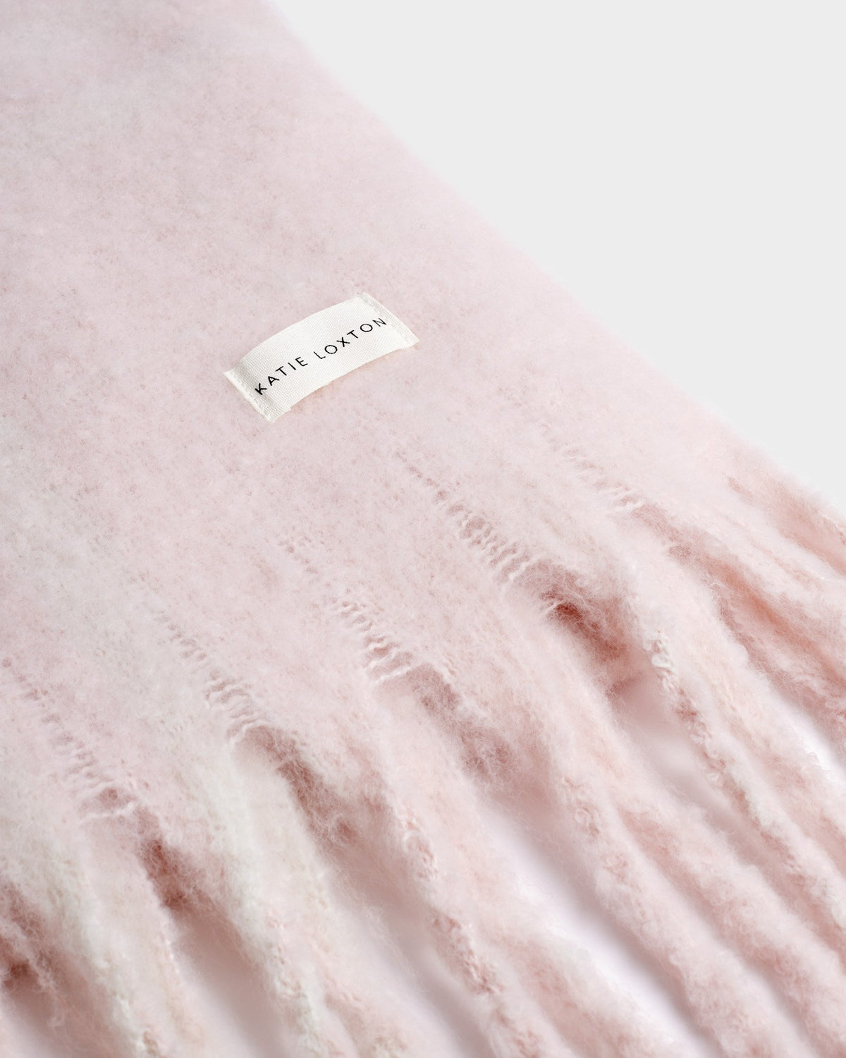 Katie Loxton Recycled Plaid Tassel Scarf in Blush Pink and White